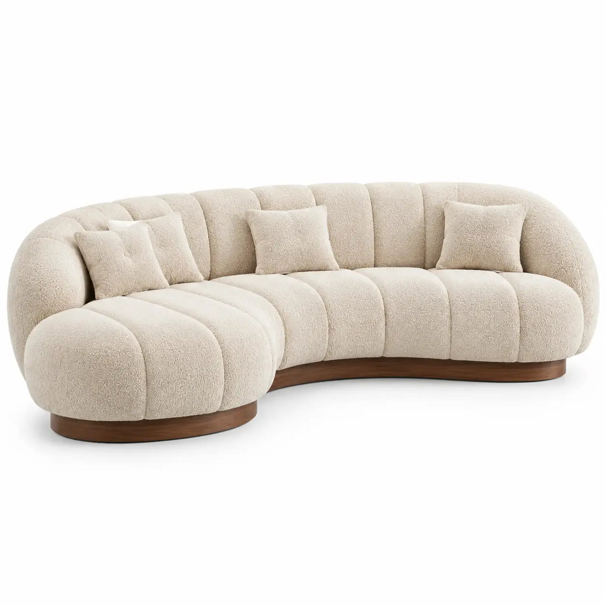 Beige upholstered curved sofa with channel-tufted design, modern furniture piece from Period Piece Shop.