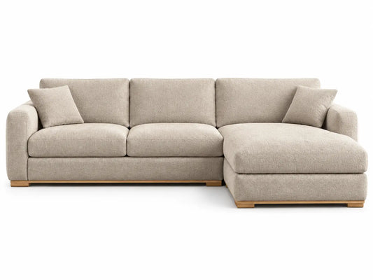 Beige sectional corner sofa with rounded armrests, upholstered in fabric, ideal for modern living room decor.