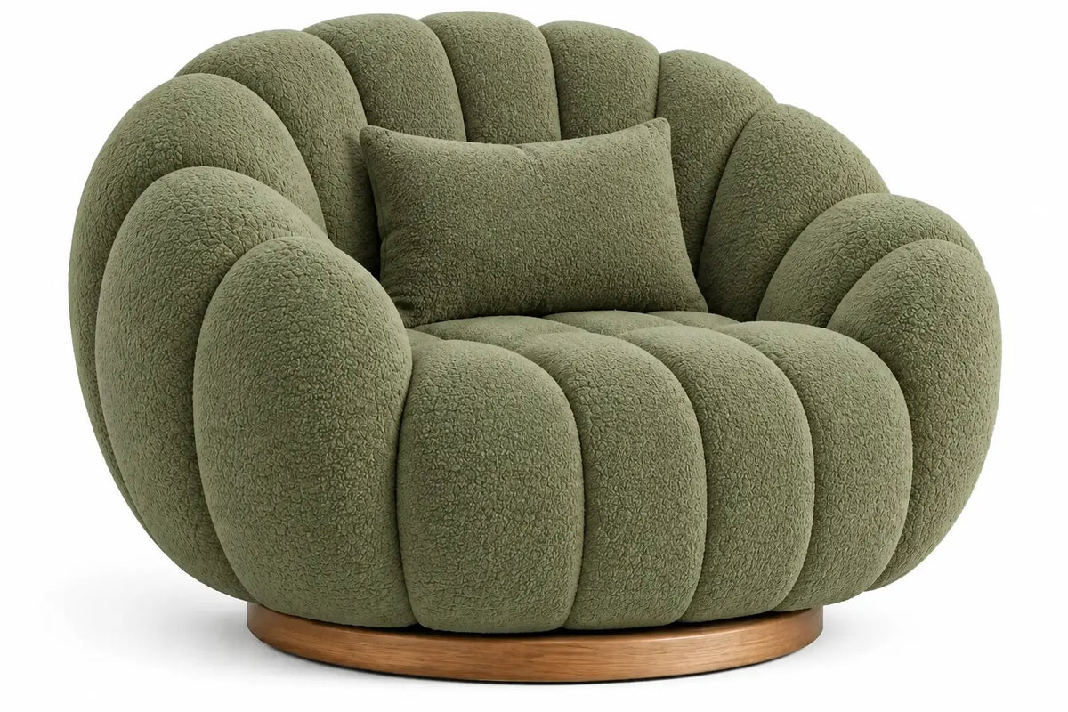 Curved upholstered armchair with channel tufting in green and brown fabric, modern and stylish furniture piece.
