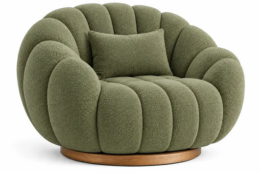Curved upholstered armchair with channel tufting in green and brown fabric, modern and stylish furniture piece.